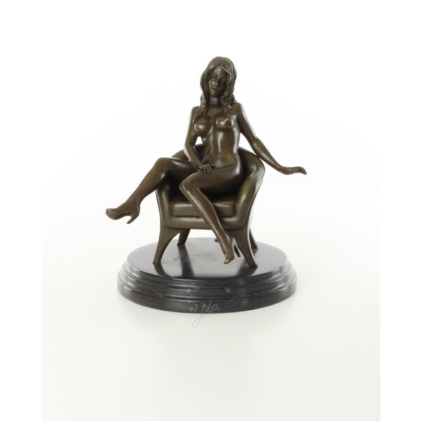  An erotic bronze sculpture of a seated female nude