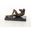 An erotic bronze sculpture of a reclining male nude