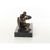 An erotic bronze sculpture of a reclining male nude