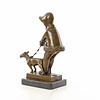 Bronzen sculptuur van een meisje met hond