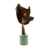 Bronze sculpture of two faces kissing