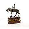 Bronze sculpture of jockey on racehorse