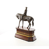 Bronze sculpture of jockey on racehorse