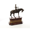 Bronze sculpture of jockey on racehorse