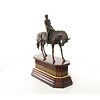 Bronze sculpture of jockey on racehorse