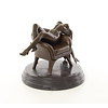 Bronze sculpture of a reclining nude female