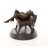 Bronze sculpture of a reclining nude female