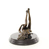 Bronze sculpture of a masturbating nude female