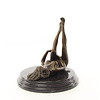 Bronze sculpture of a masturbating nude female