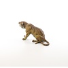 Bronze sculpture of a sitting tiger