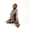 Large bronze sculpture of a kneeling female nude
