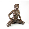 Large bronze sculpture of a kneeling female nude