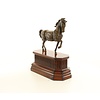 Bronze sculpture of a trotting horse