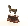 Bronze sculpture of a trotting horse