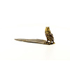 A bronze inkwell and pen holder shaped as an owl with feather