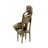 A bronze sculpture of an enticing female seated on a chair