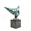 A modern bronze sculpture of a voluptuous gymnast