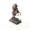 A bronze sculpture of Napoleon crossing the Alps