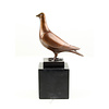 Bronze sculpture of a standing pigeon