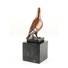 Bronze sculpture of a standing pigeon