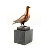 Bronze sculpture of a standing pigeon