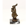 Bronze sculpture of a female rabbit holding her bunny