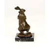 Bronze sculpture of a female rabbit holding her bunny