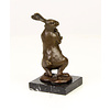 Bronze sculpture of a female rabbit holding her bunny