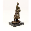 Bronze sculpture of a female rabbit holding her bunny