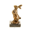 Bronze sculpture of a rabbit holding a carrot