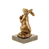 Bronze sculpture of a rabbit holding a carrot