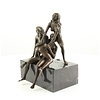 Bronze sculpture of a threesome having sex