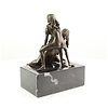 Bronze sculpture of a threesome having sex
