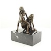 Bronze sculpture of a threesome having sex