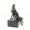 Bronze sculpture of a threesome having sex