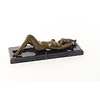 An erotic bronze sculpture of a reclining female nude