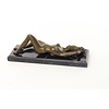 An erotic bronze sculpture of a reclining female nude