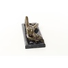 An erotic bronze sculpture of a reclining female nude