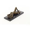 An erotic bronze sculpture of a reclining female nude