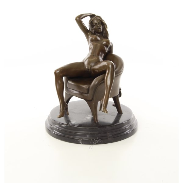  An erotic bronze sculpture of a sitting nude female
