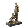 Bronze sculpture of a kneeling female nude pleasing a man