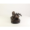 Bronze sculpture of two fighting stags