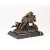 Bronze sculpture of hounds attacking a wild boar