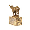 Bronze sculpture of a bellowing  bull mounted on a marble base