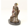 Bronze sculpture of a woman embracing a phallus