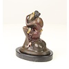 Bronze sculpture of a woman embracing a phallus