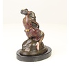 Bronze sculpture of a woman embracing a phallus