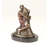 Bronze sculpture of a woman embracing a phallus