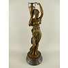 A bronze sculpture of Hebe with an urn (left)