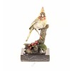 Bronze sculpture of a cardinal bird sitting on a branch